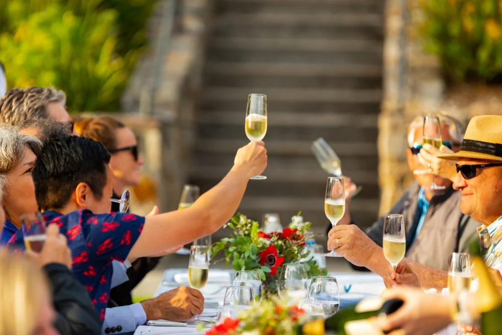 Mumm Napa Winery's Events where people are raising their sparkling wine glasses